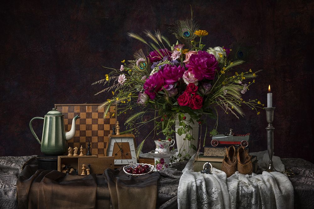 Flower still life with peonies and chess board