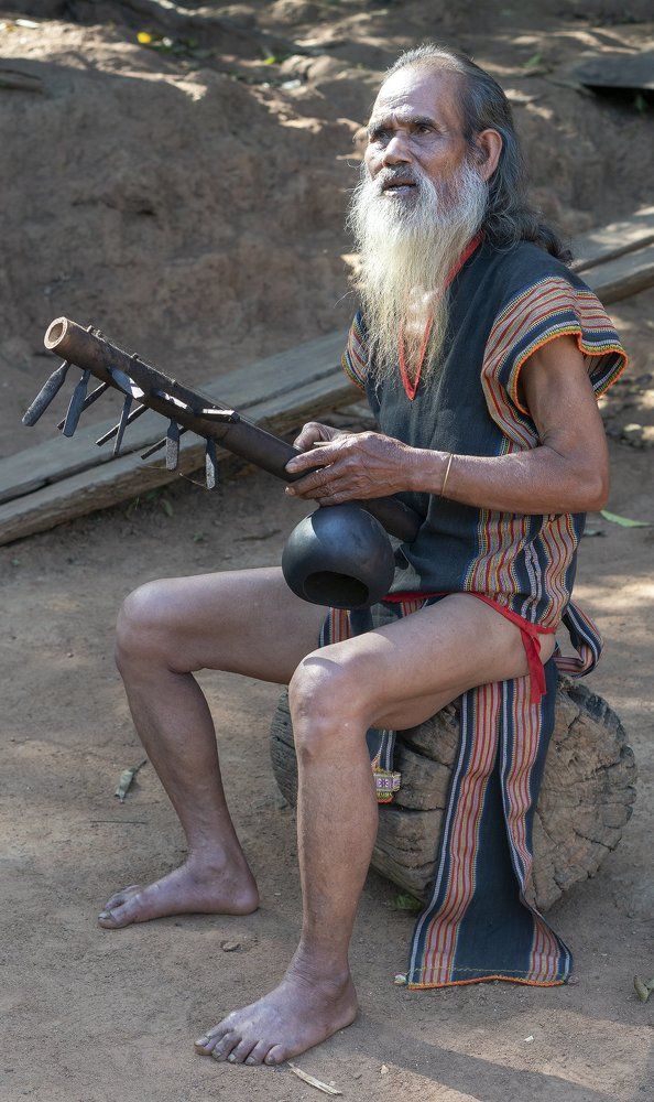 Old man with musical instrument.