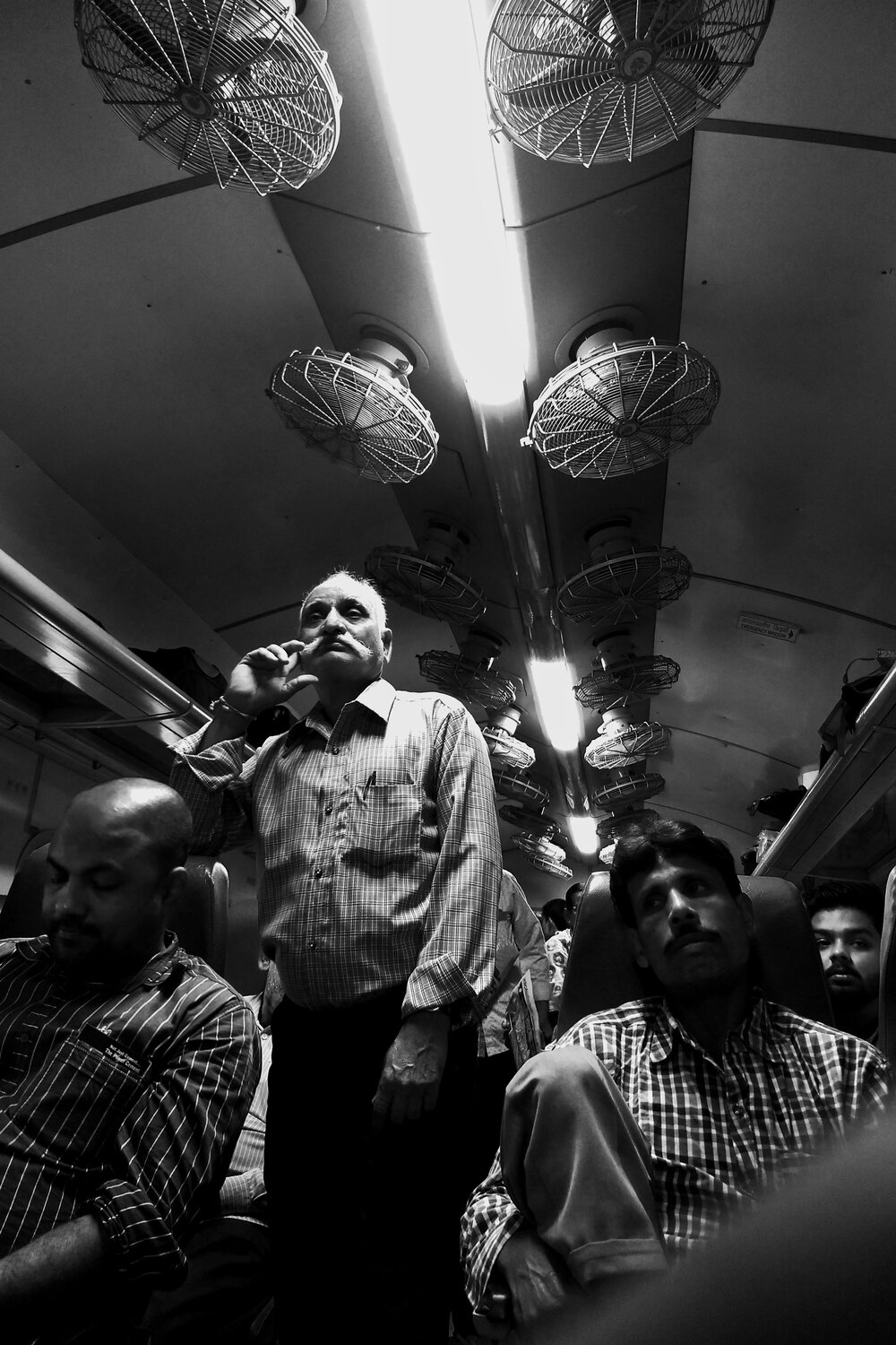 Moustache Man inside Train compartment