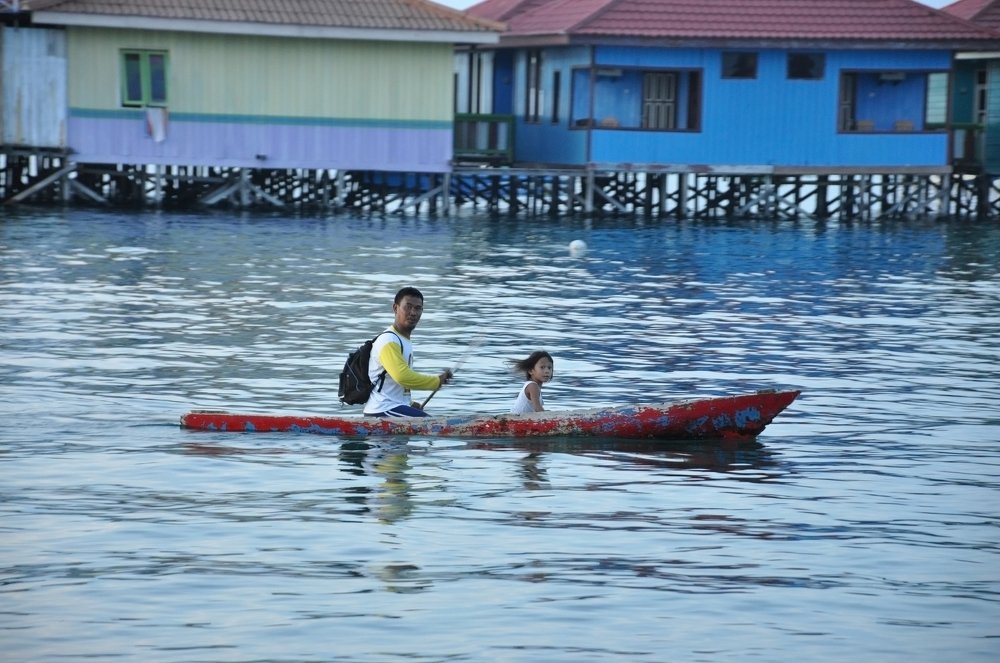 Father Taking His Chile by Boat