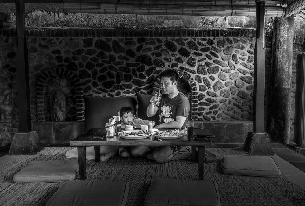 Taking his son out to dinner