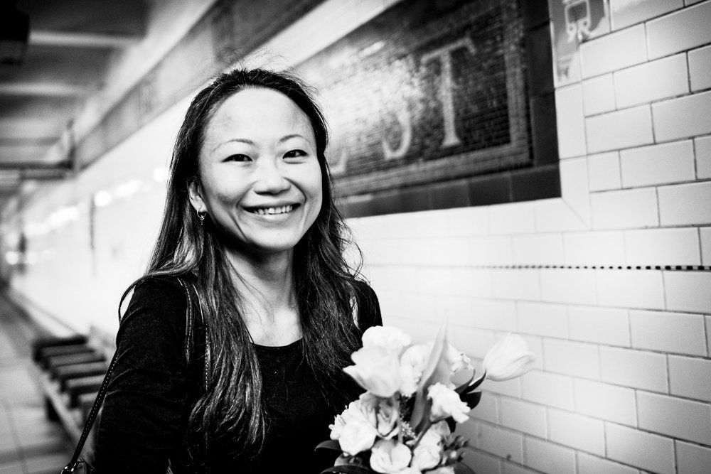 The girl with the bouquet of flowers.