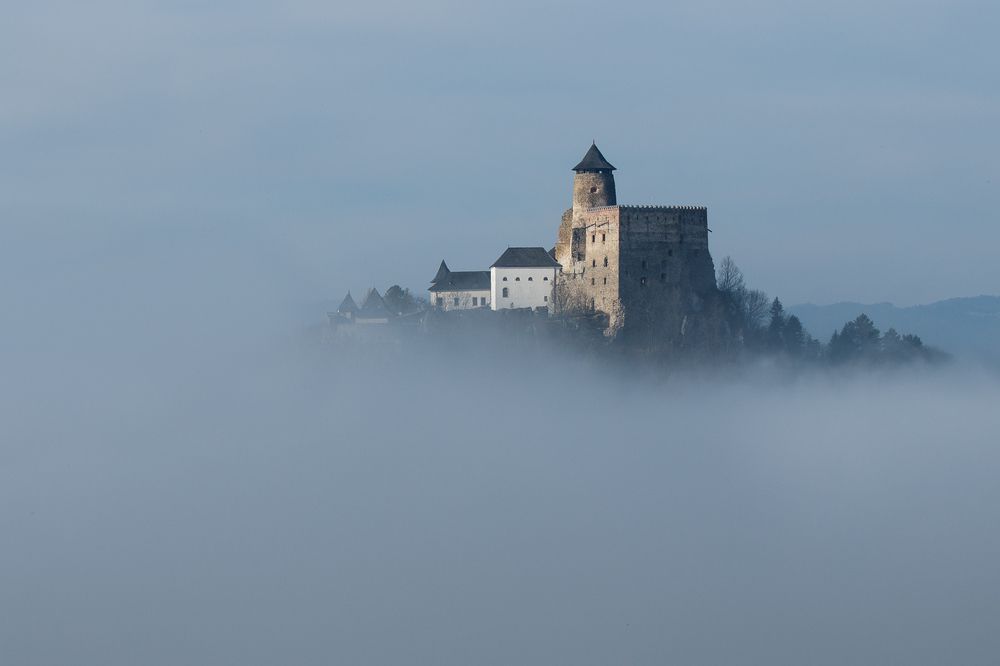 castle Lubovna flying in clouds