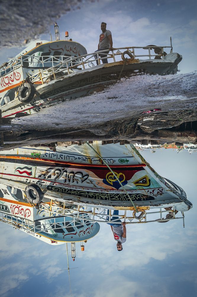 Morning fishermen backward in reflection
