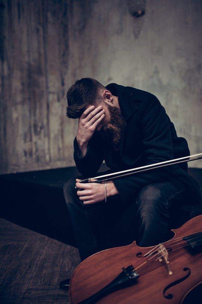 Виолончелист