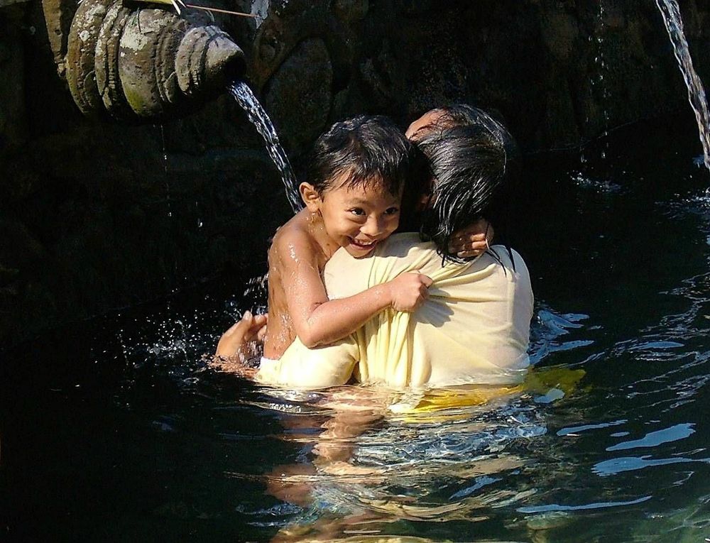 Boy and his mother in bath