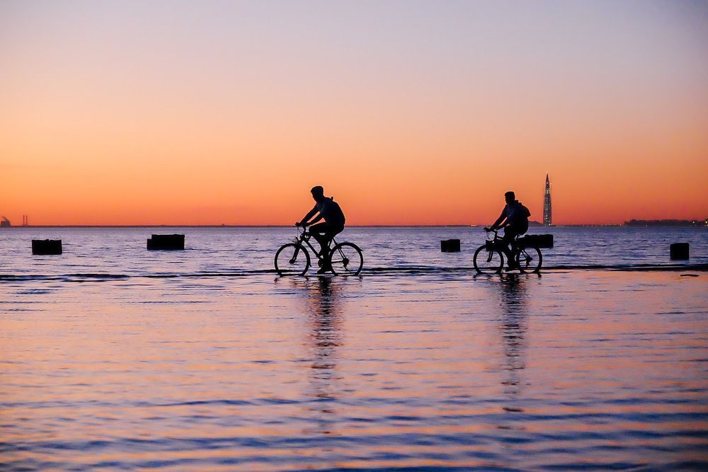 Сyclists at sunset