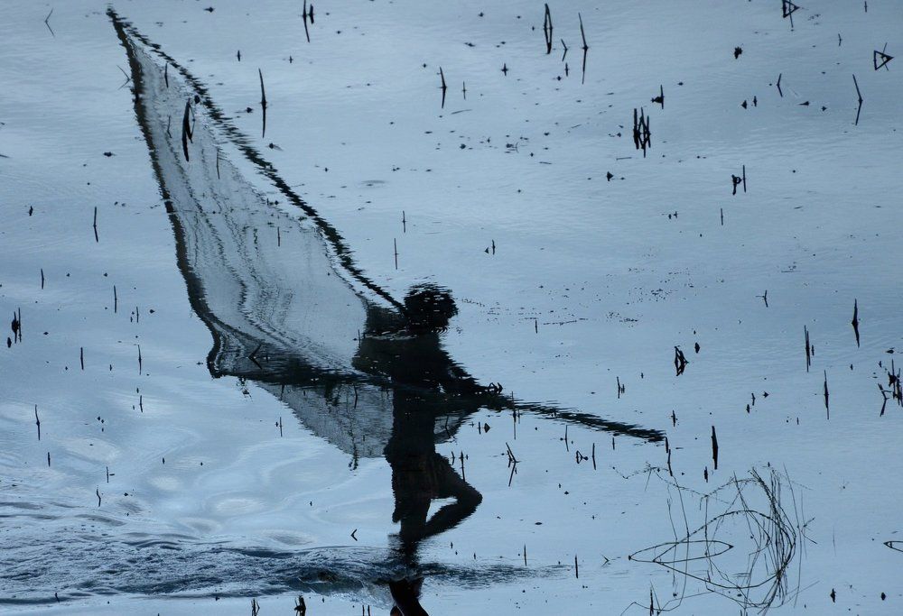 Reflection Of Fisher Man