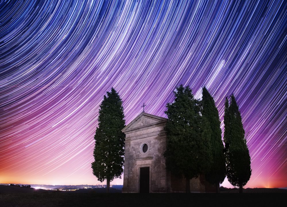 Tuscany landscape with star tracks