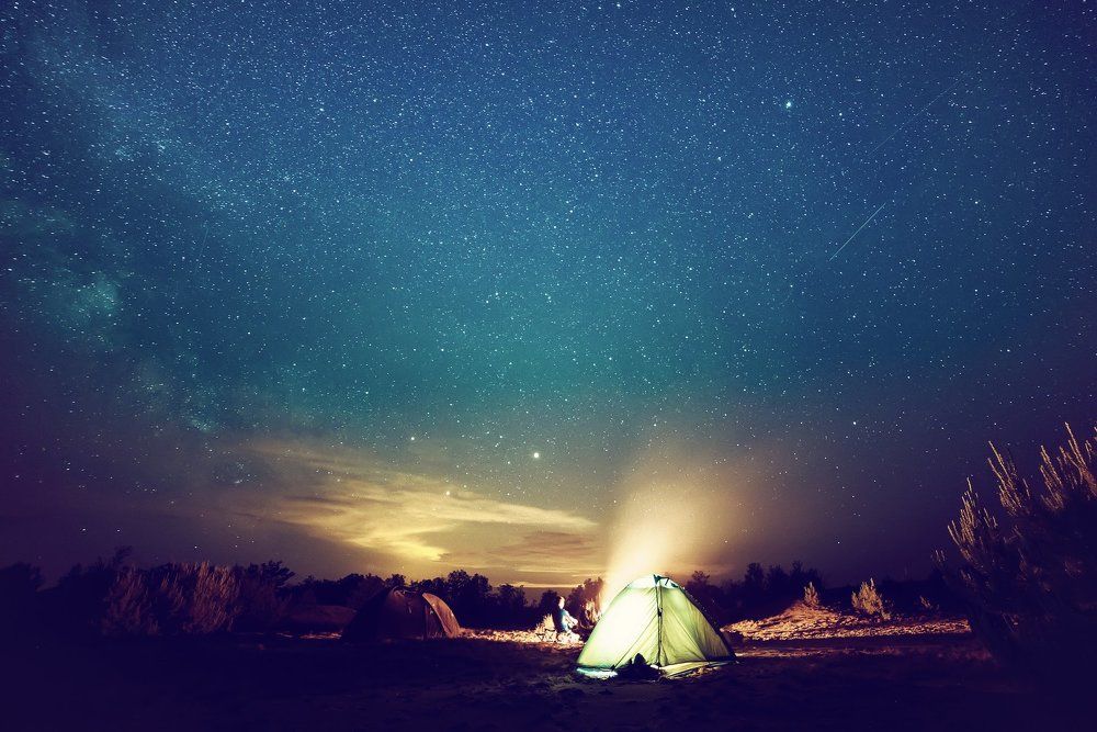 Camping fire under the  starry sky