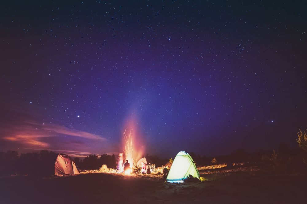 Camping fire under the  starry sky