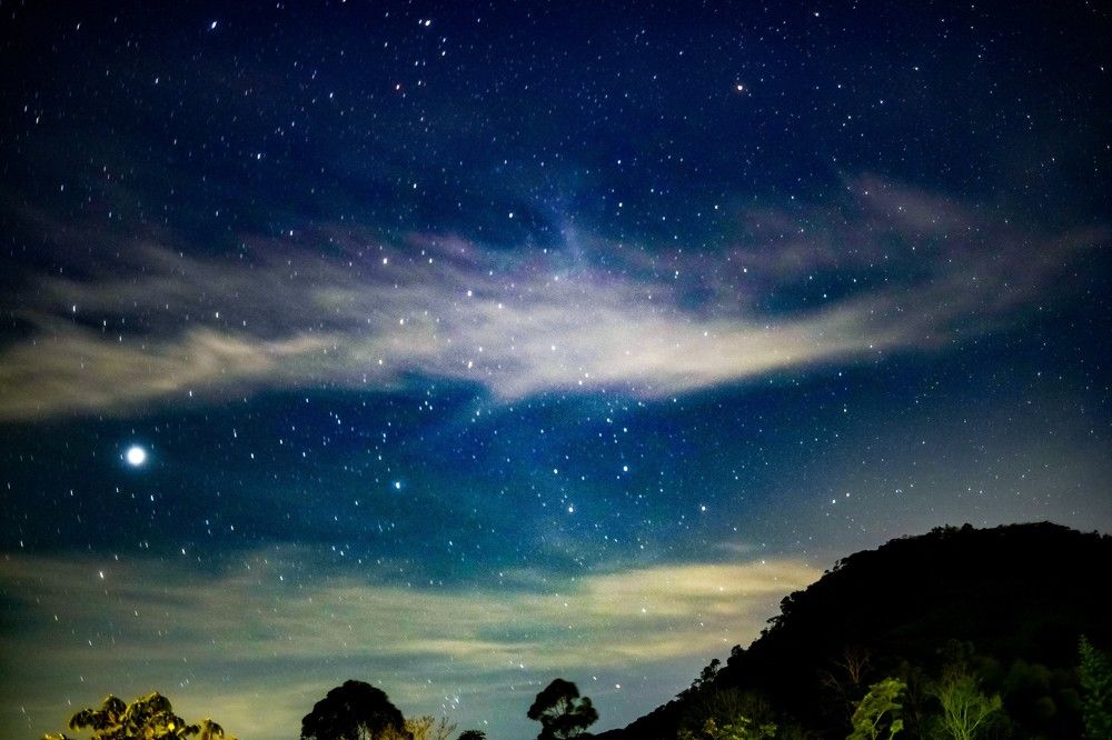A galaxy above the hills