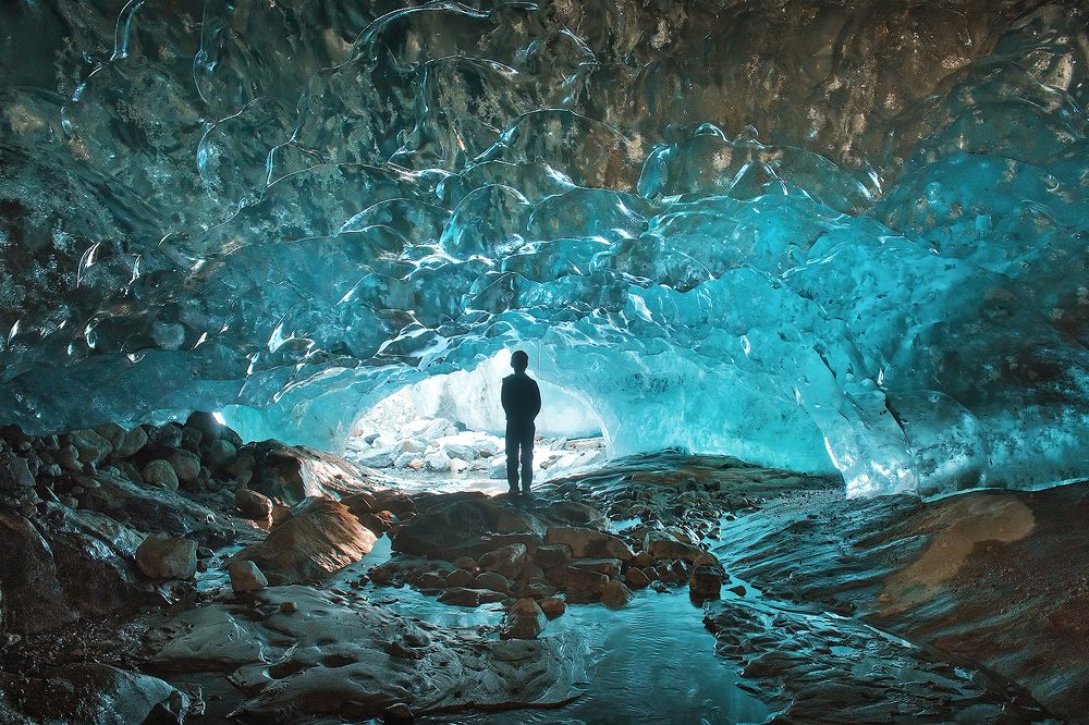 Under the thickness of ice in the emerald hall of Alibek glacier, November 2018