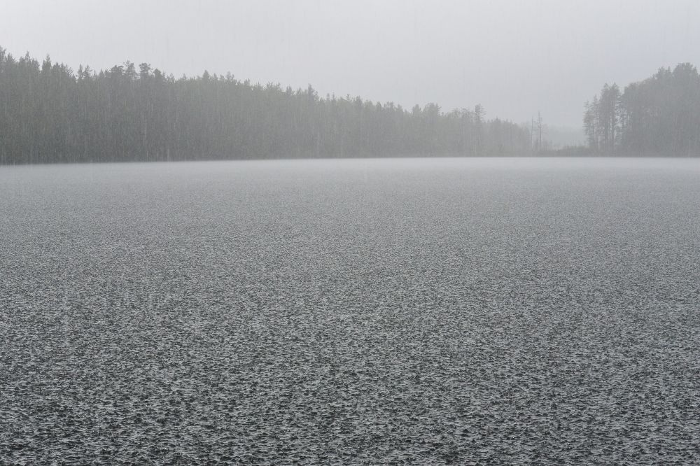 The sky fills the lake with rain.