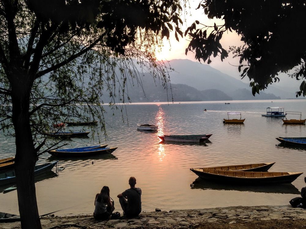 Lovers on the lake at sunset