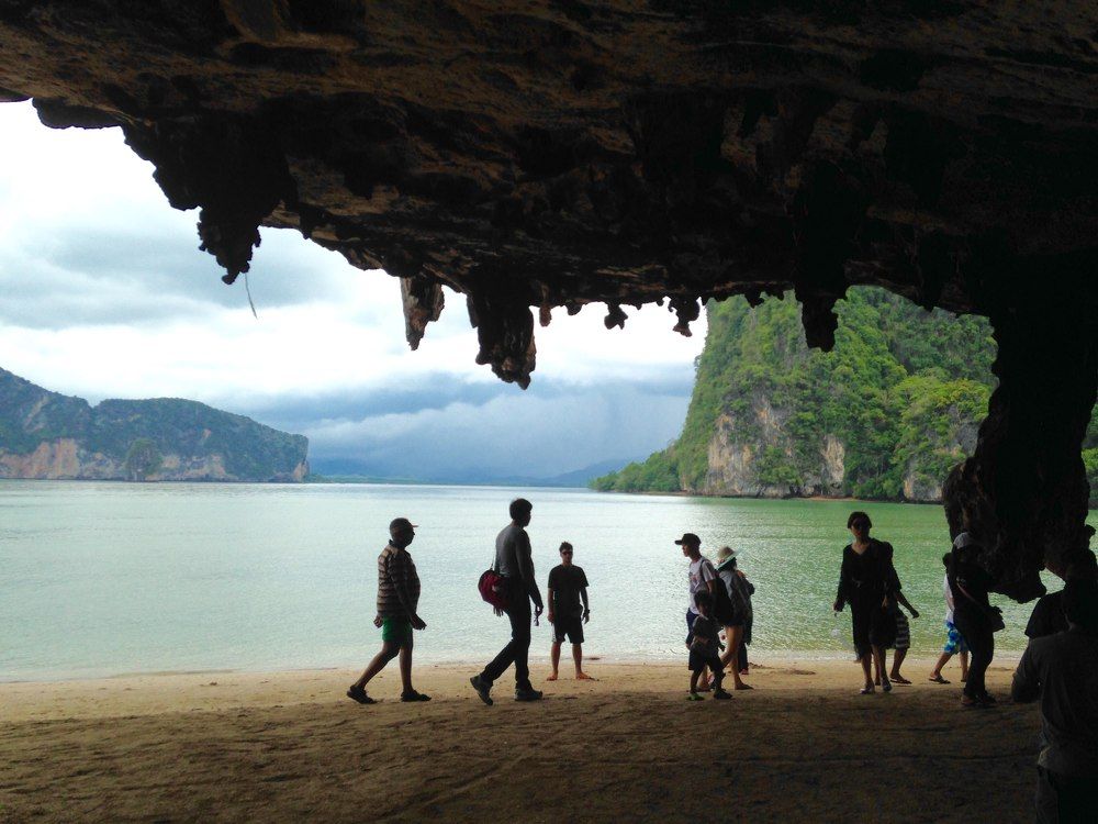 Silhouettes of people in the cave