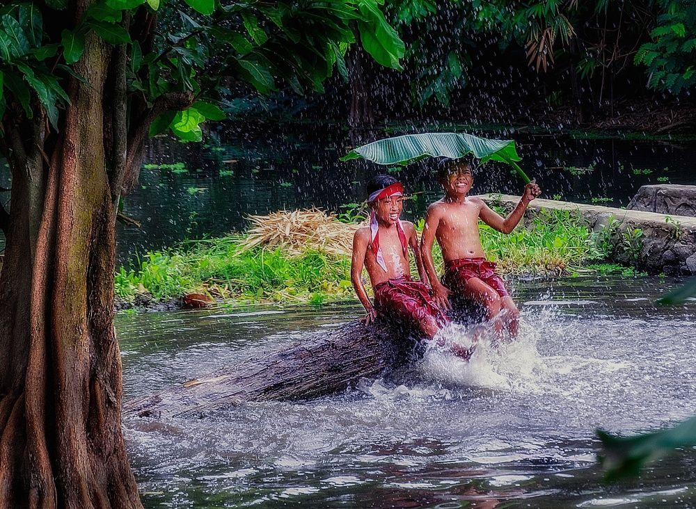 Children's fun playing rain