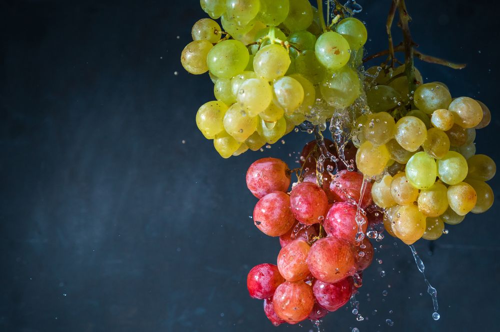 grapes in water splashes