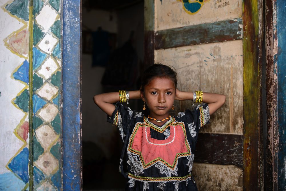 Ahir girl in front of her home