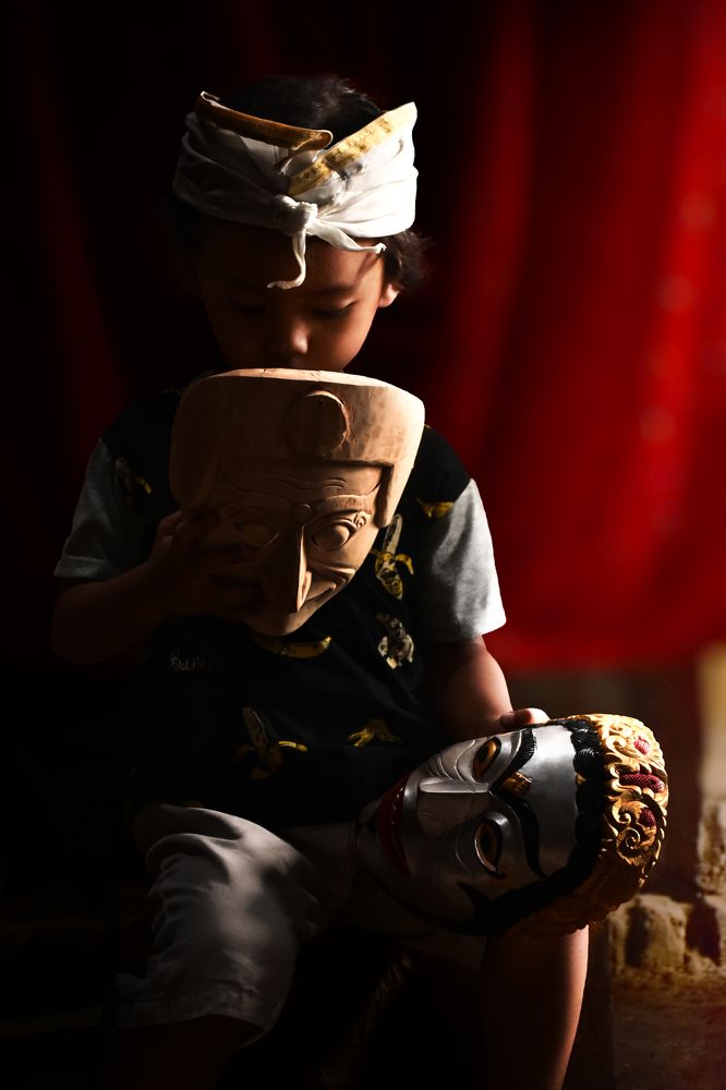 Little boy and two masks