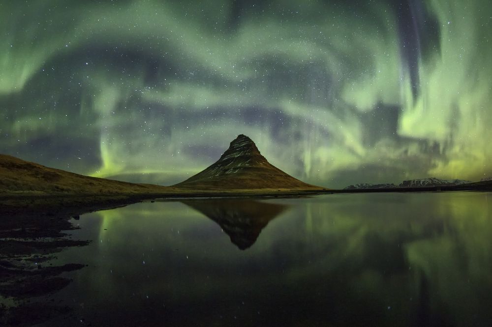 Green storm over Kirkjufell mountain. Iceland.