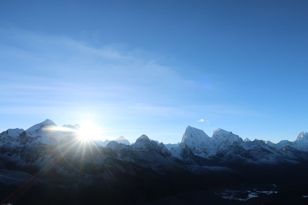 sunrise in snow mountains