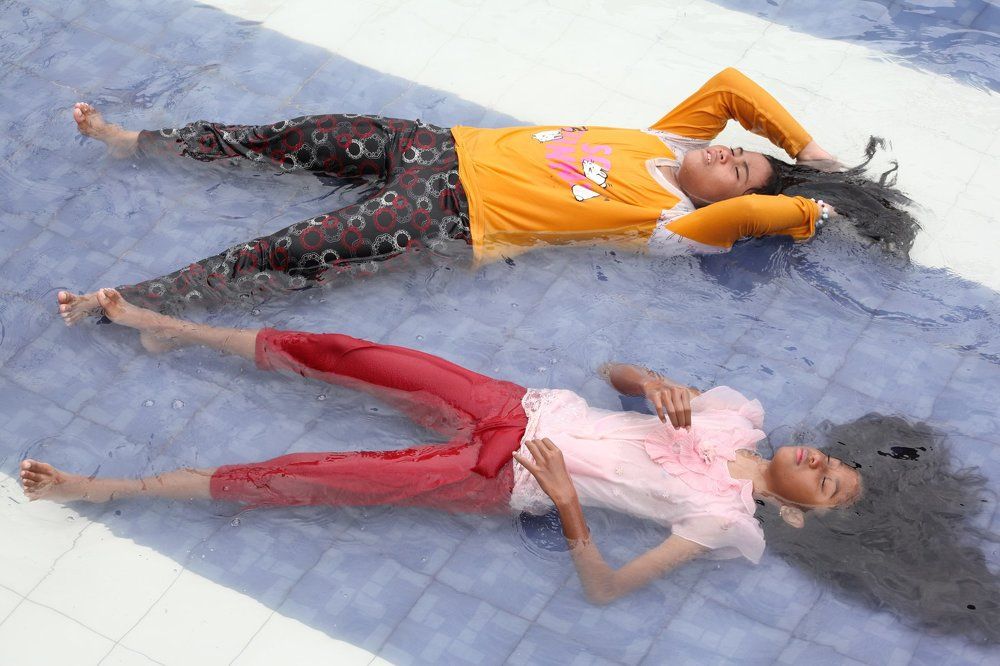 lying in a shallow pool