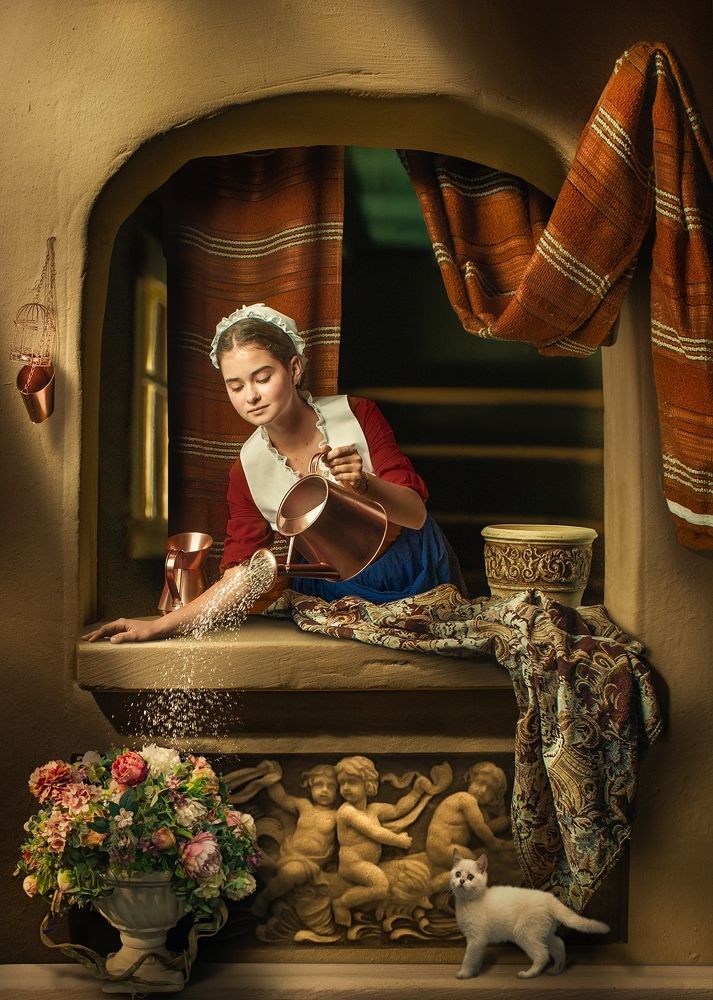 The young girl watering flowers