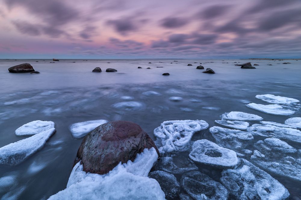 Icy coast in windy evening