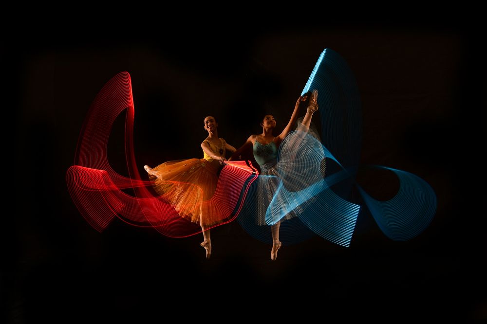 duo balerinas dance with lighting