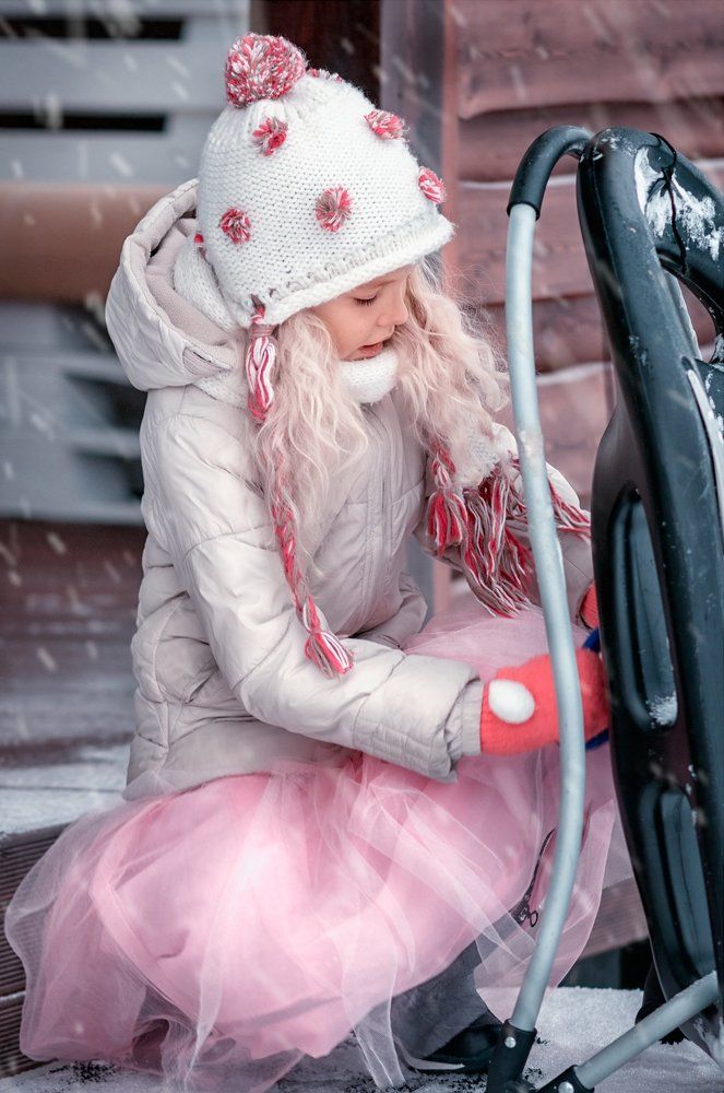 frosty cheeks of a little smiling girl