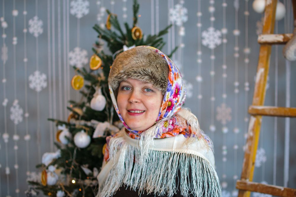 Smiling woman in hat and shawl