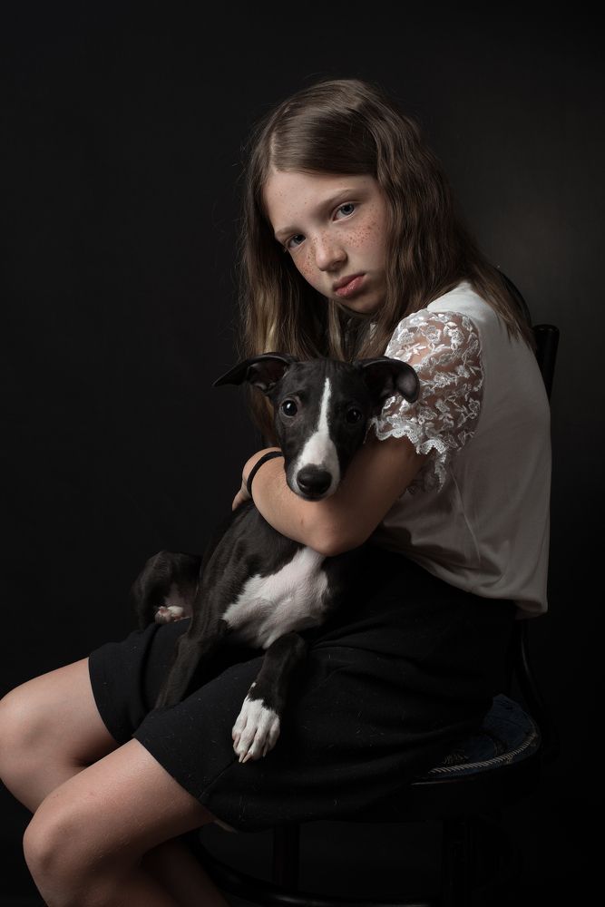 Portrait of a girl with a dog