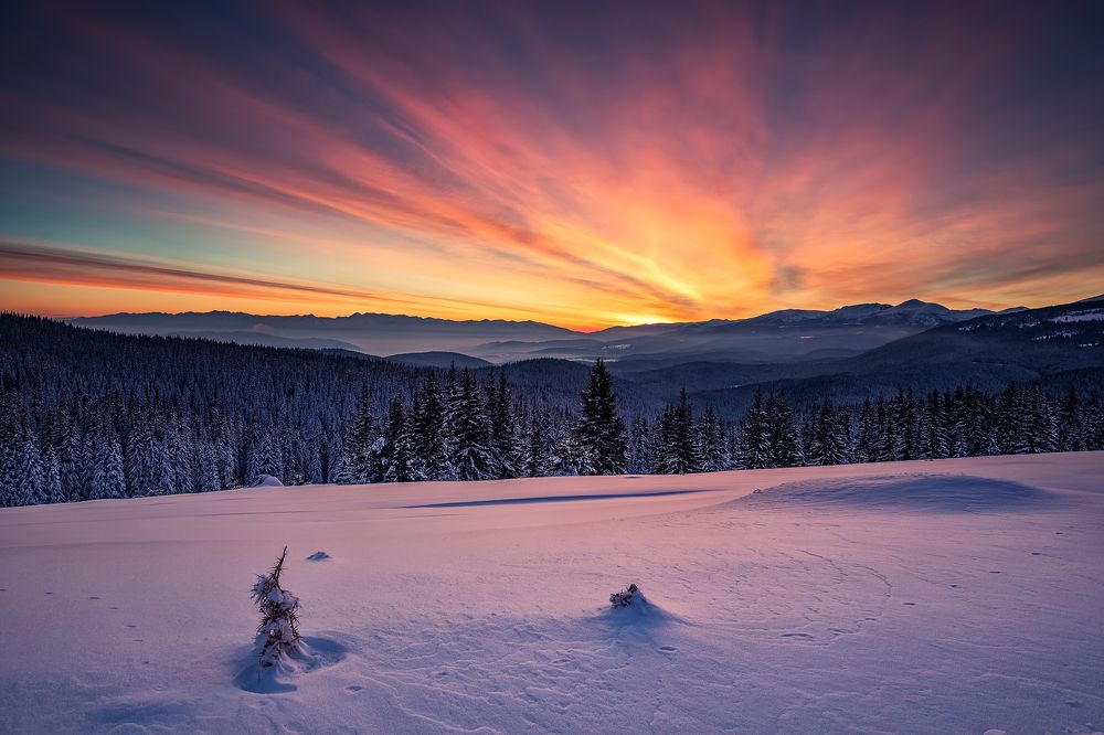 Sunset in snow mountain
