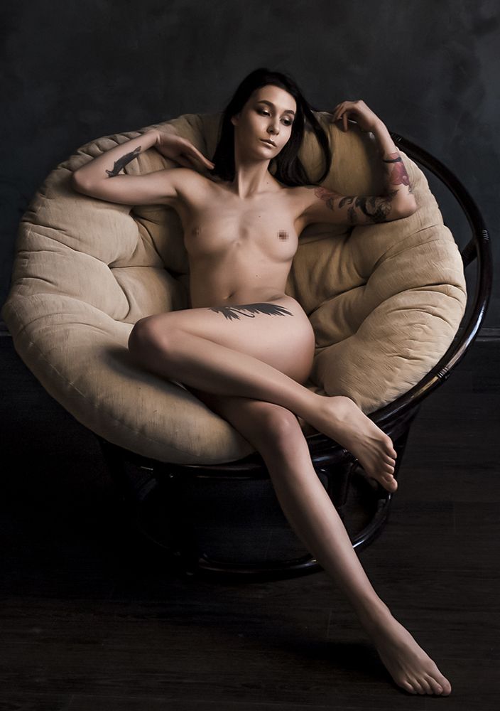Naked one In the armchair