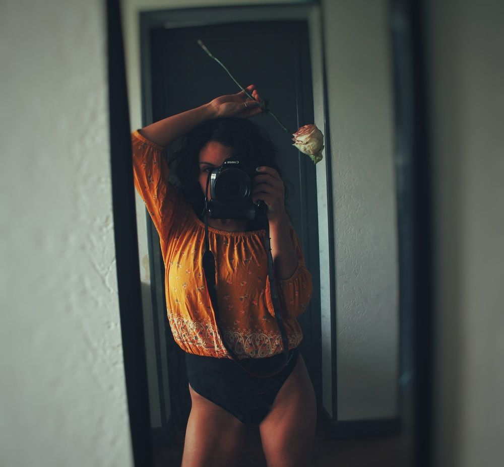 female body, an eye, a flower and beauty