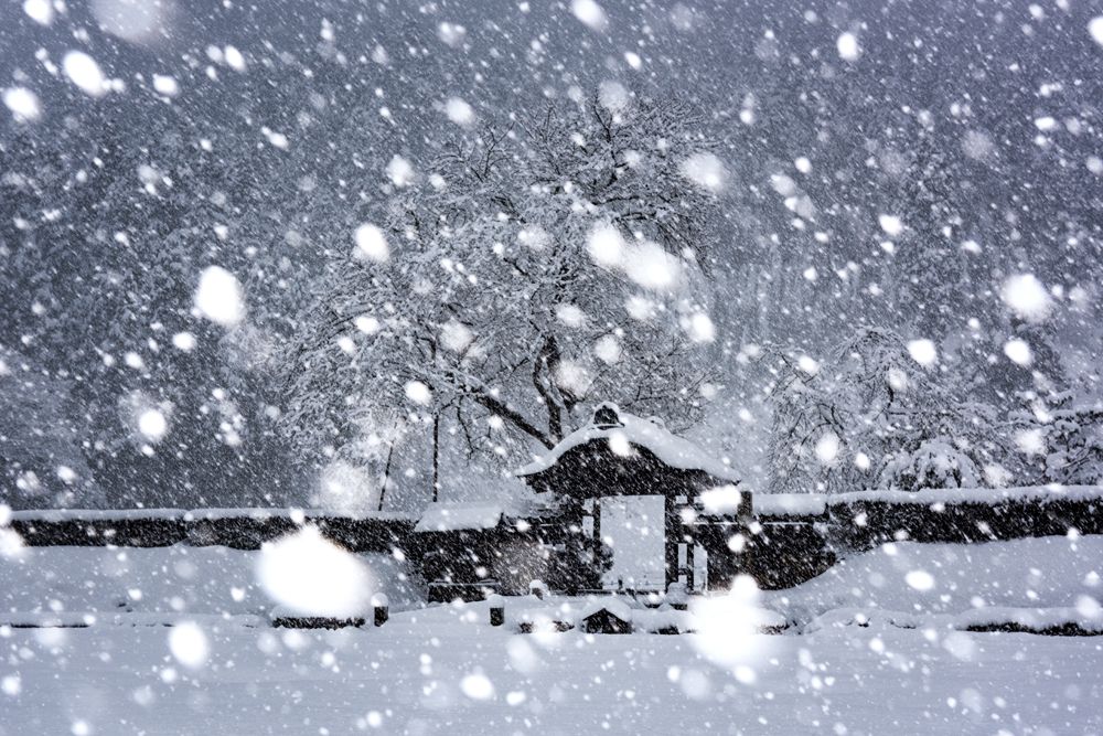 Snow falling on ruins