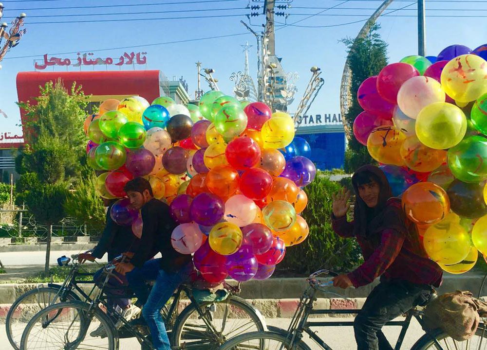 young boys sale balloon and the color of these balloons give the message of peace
