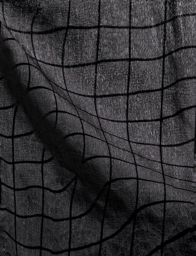 Shadows of the grill of the window