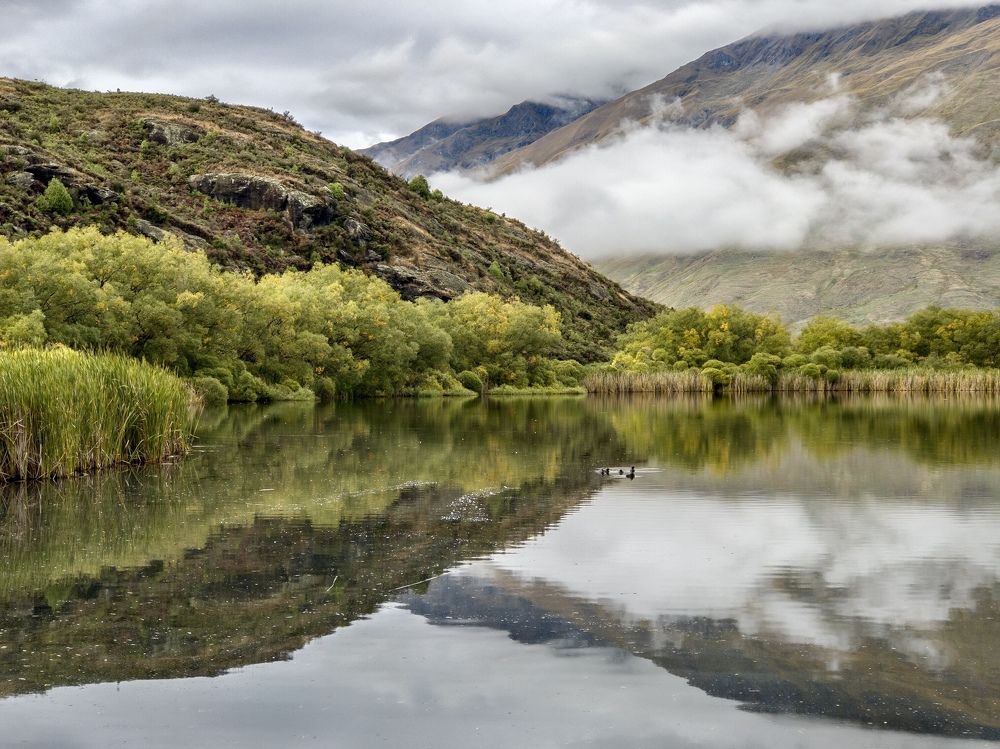 A mountain reflection across the lake