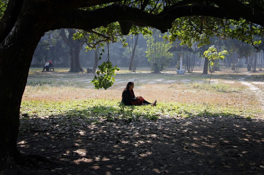 Girl enjoying sunbath at witner morning