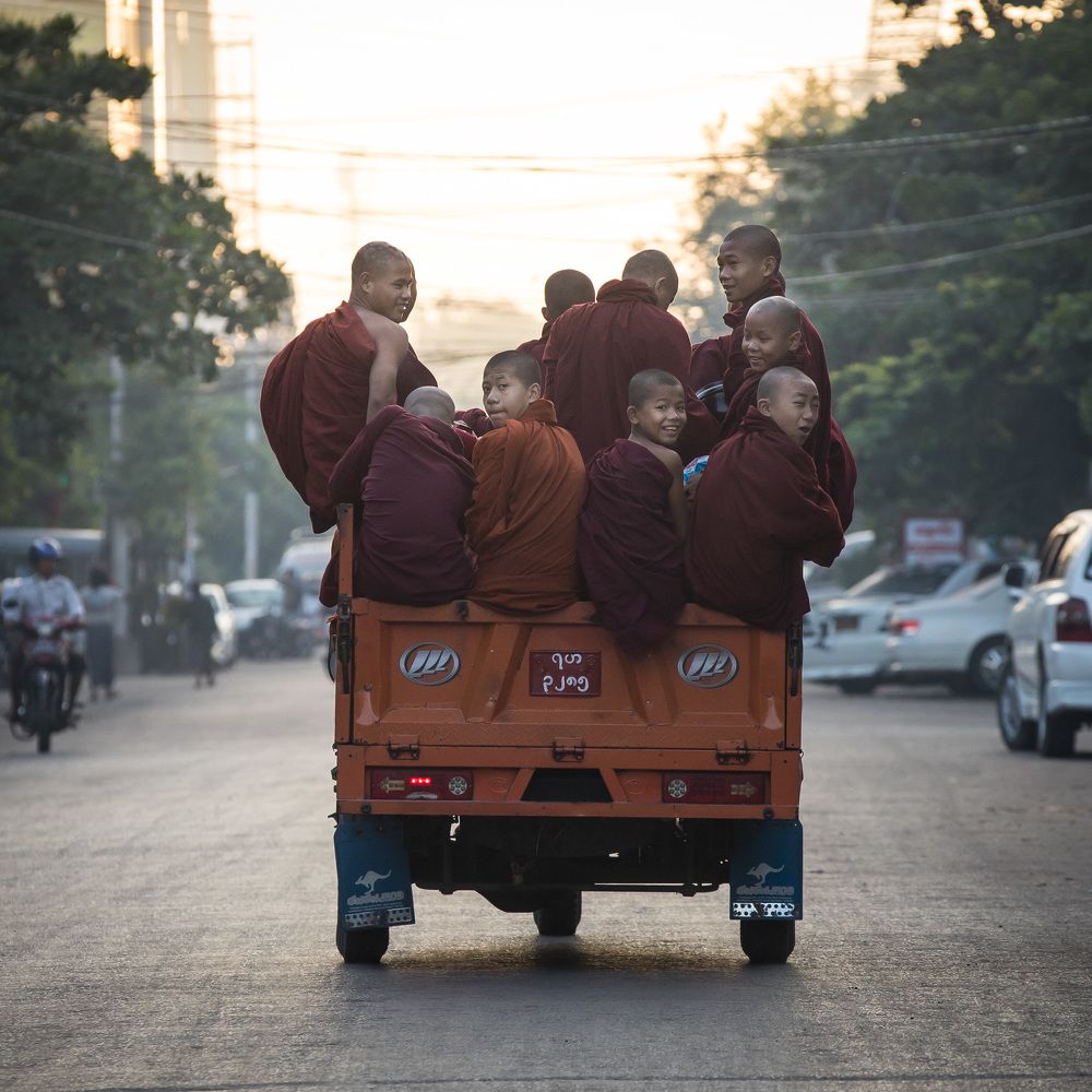 Монахи едут с  собранным подаянием в храм