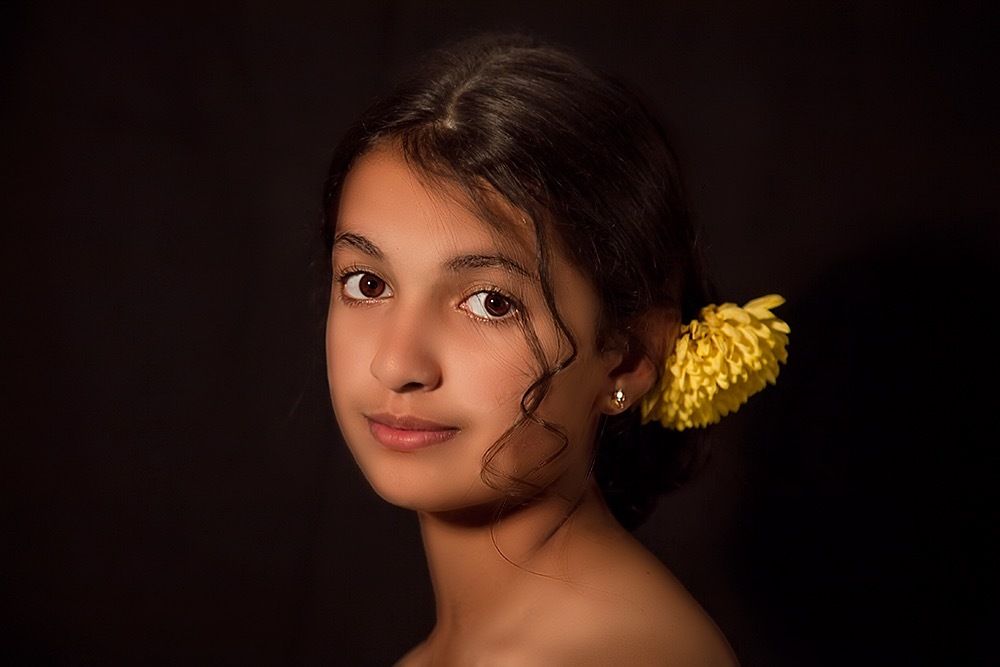 Girl with yellow flower
