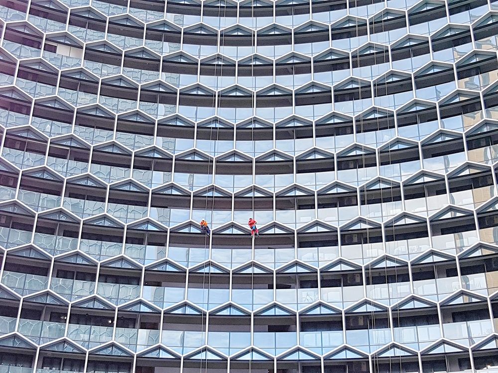 Workers cleaning windows