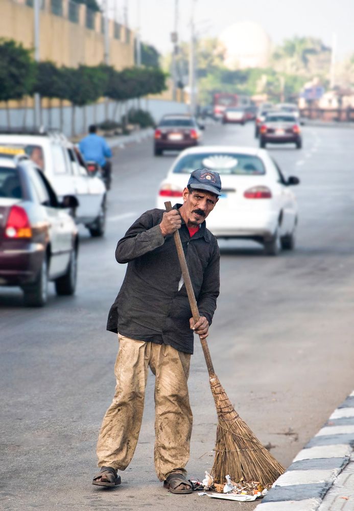 A poor cleaner doing his work to get his living