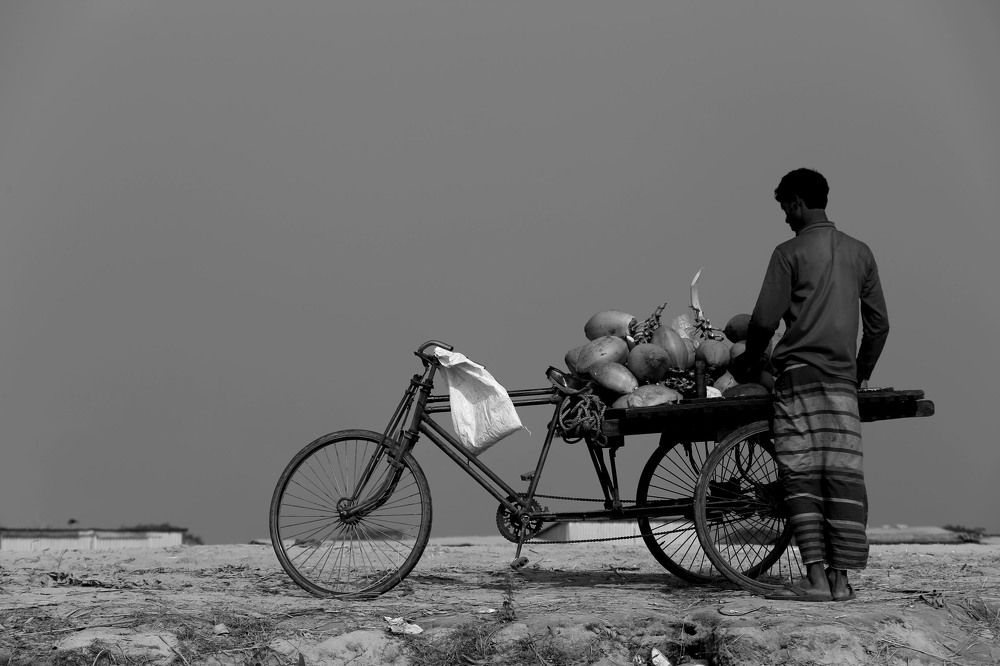 A Green Coconut Seller.
