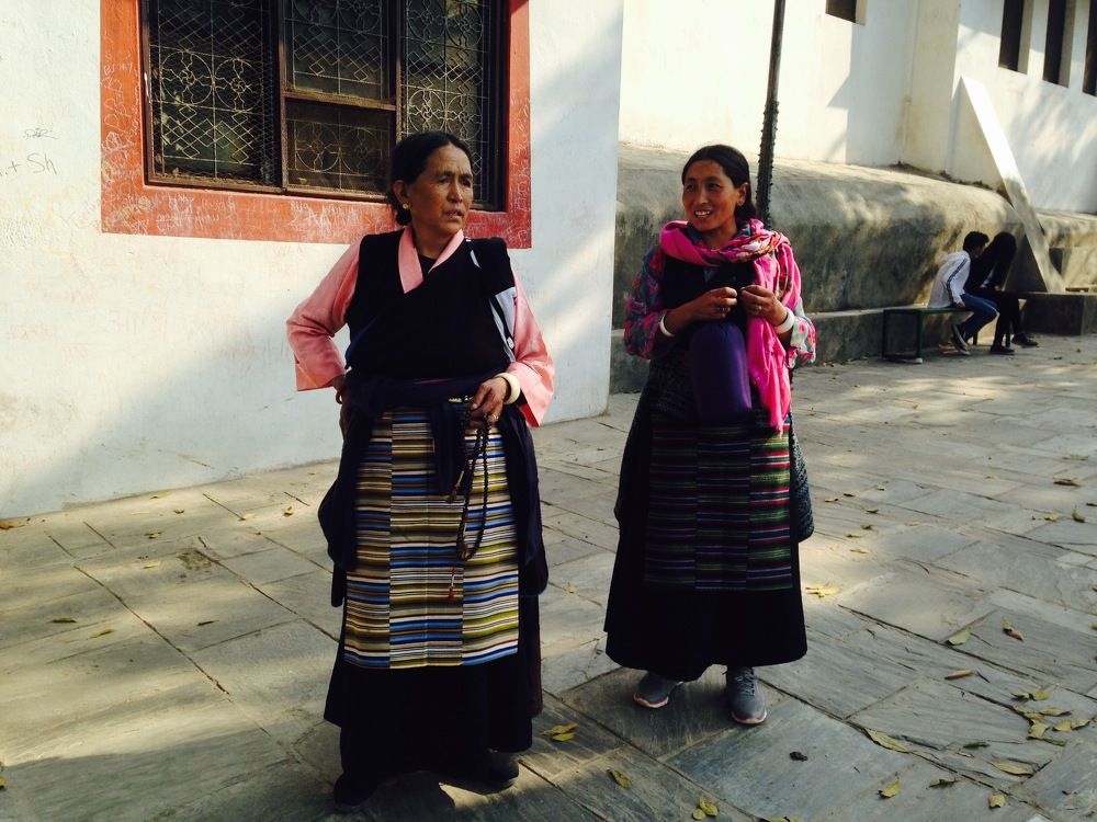 Nepalese women in traditional clothes in Swayambhunath temple