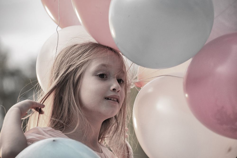 Girl with balloons.