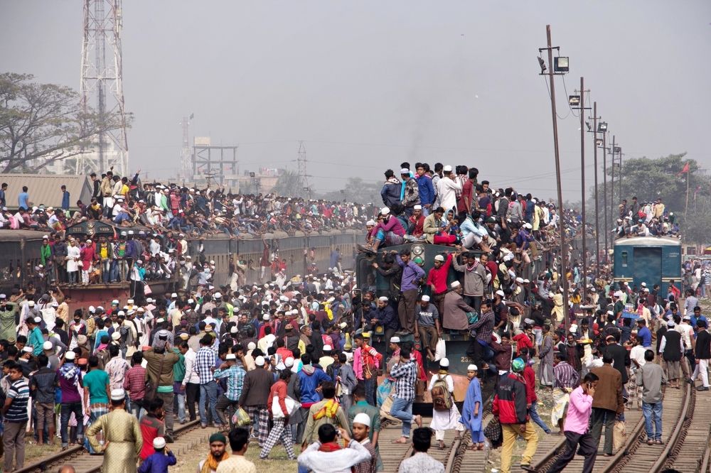 crowd of islamic congregation in rail sta tion