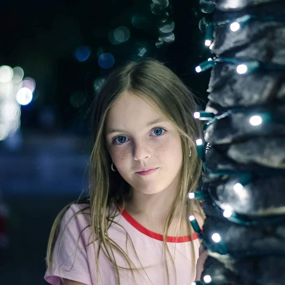 Girl witl Christmas lights